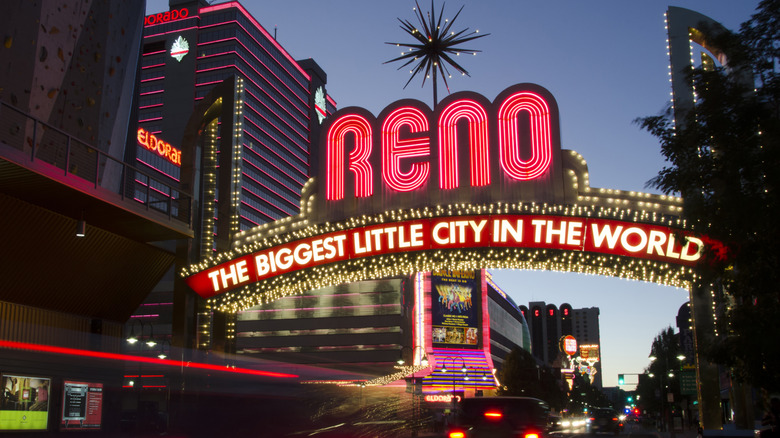 Cars driving past Reno sight in the evening