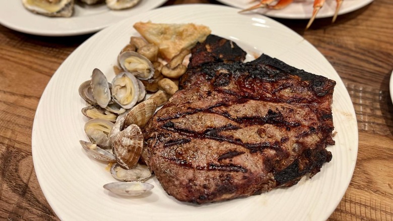 Steak and clams on plate at Grand Buffet