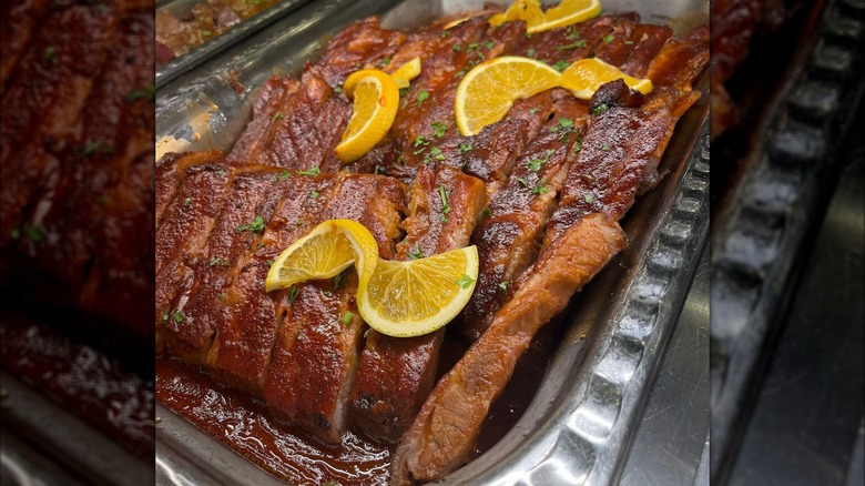 Barbecue ribs garnished with lemon at Toucan Charlie's Buffet