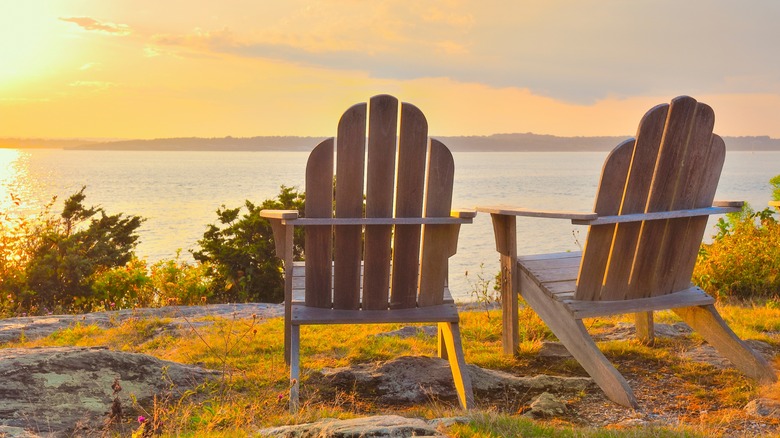 Adirondack chairs overlooking sunset