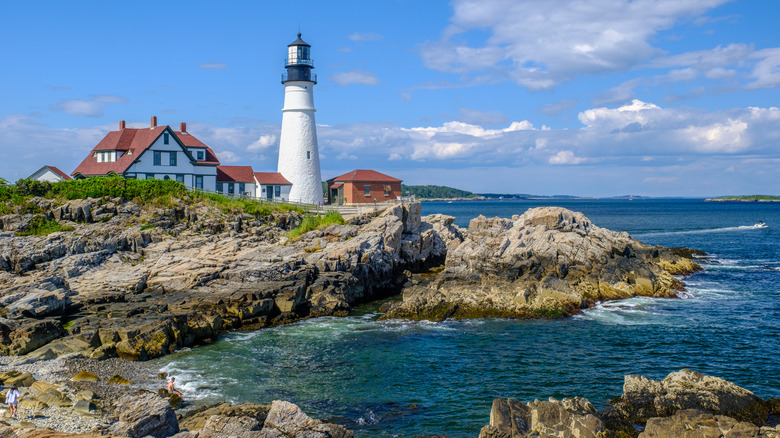 lighthouse on rocky sea harbor