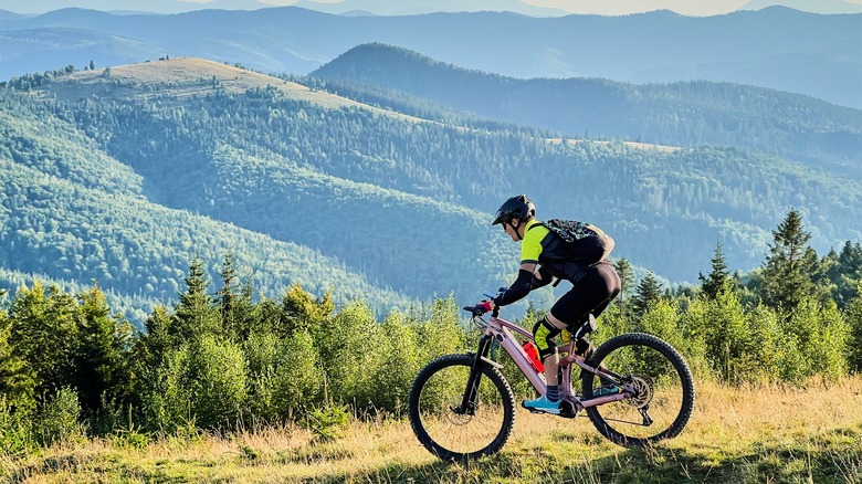 Cyclist riding a mountain e-bike on hill