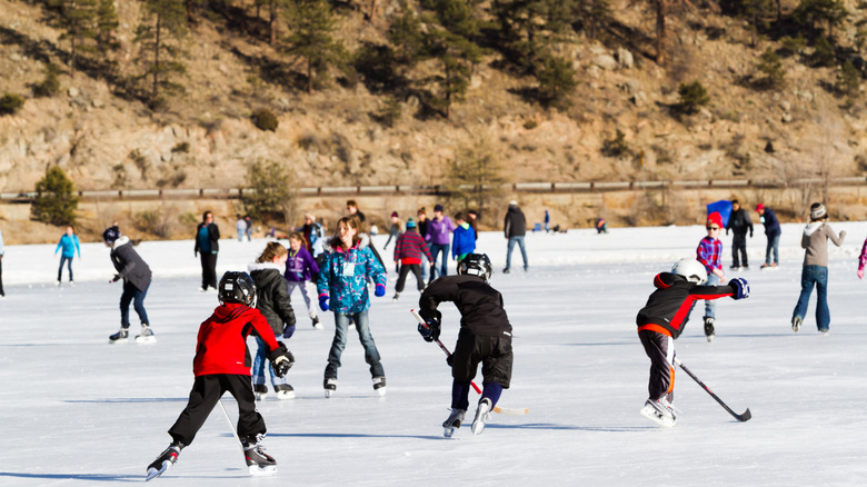 Kids skating and playing hockey on Evergreen Lake.