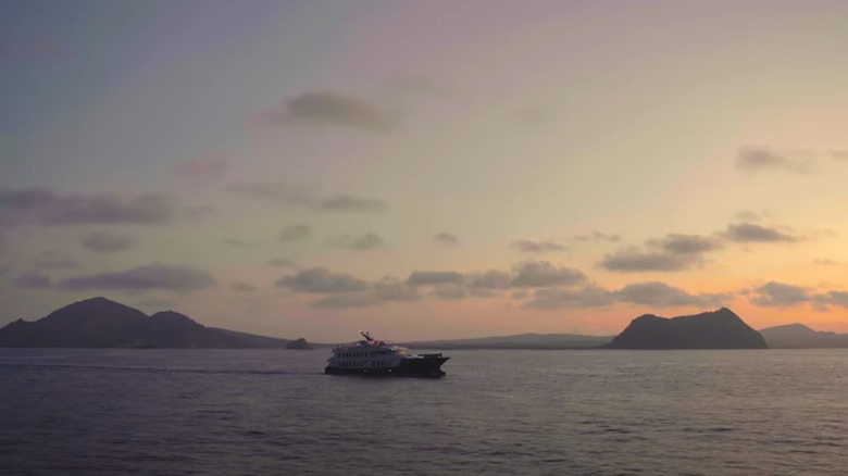 an Ecoventura ship sailing in front of the Galapagos Islands