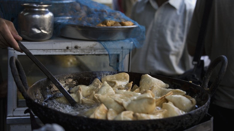 Street food vendor making samosas in Mumbai