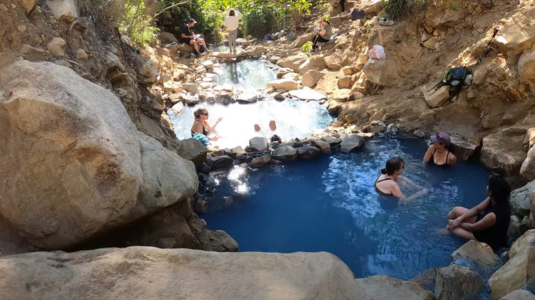 bathers in a hot spring pools