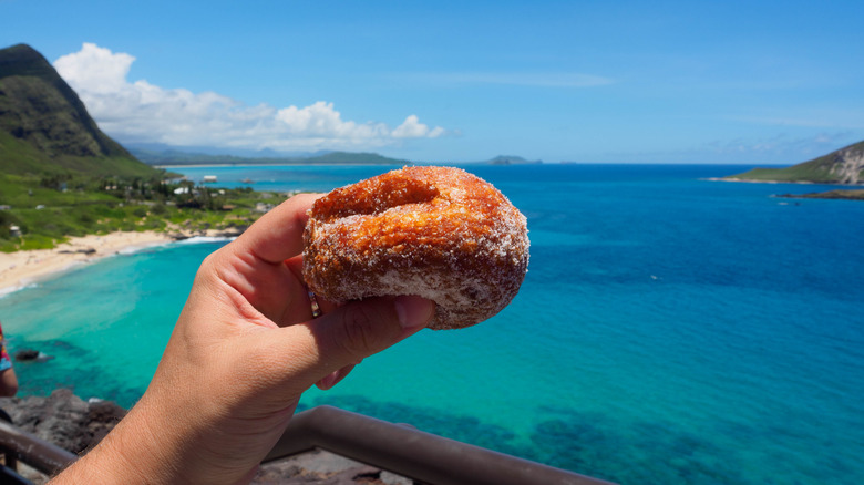 Person holding Hawaiian malasada pastry