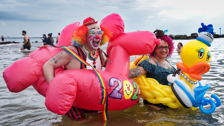 People braving the colds water in January to participate in the polar bear plunge in New York