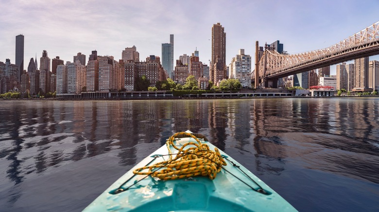 Kayak facing New York City from East River