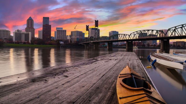 Kayak opposite Portland skyline at dusk