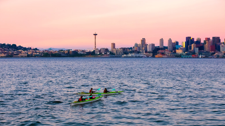 Kayakers on Puget Sound with Seattle skyline