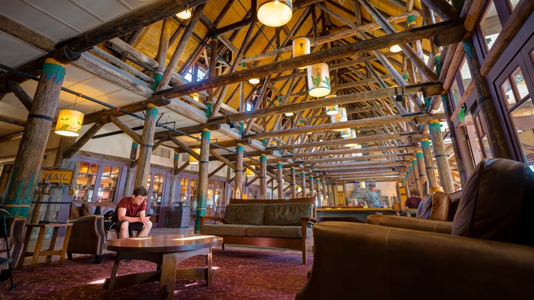 man sitting in lobby of Paradise Inn