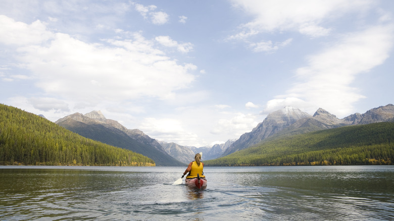 woman kayaking in Glacier National Park