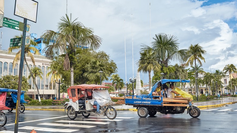 tuk tuks transporting passengers outside Iquitos Airport in Peru