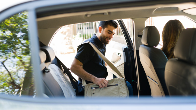 Person getting into their rideshare car