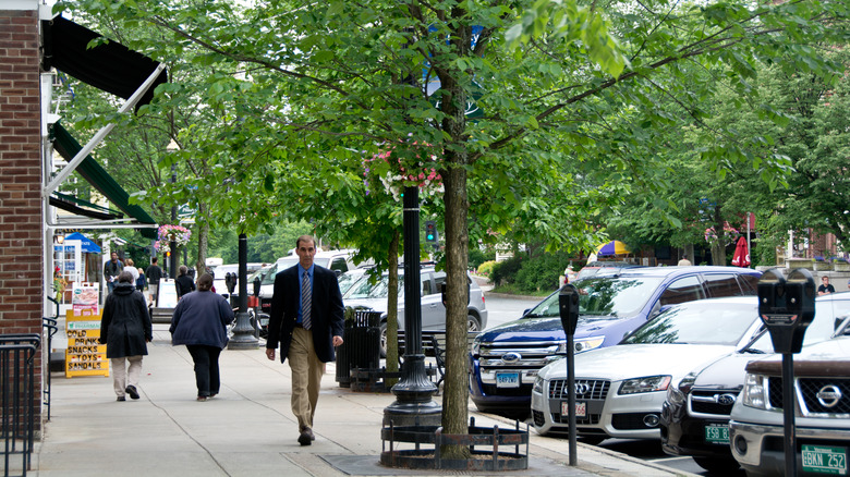 Downtown Hanover street with pedestrians walking and parked cars