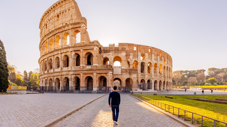 Man walking toward Colosseum 