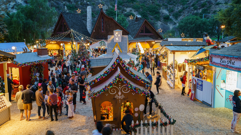 People walking around the Sawdust Winter Art Festival Christmas village