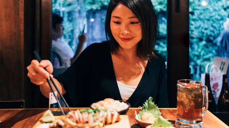 Female eating solo in restaurant in Japan