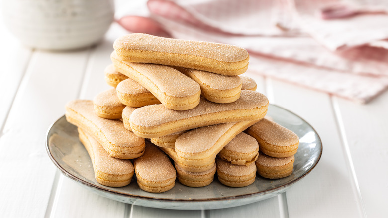 Savoiardi cookies stacked on a plate