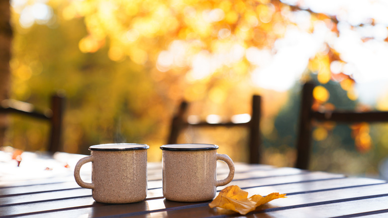 Hot beverage and fall leaves