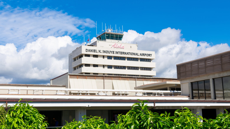 Honolulu International Airport with trees lining front