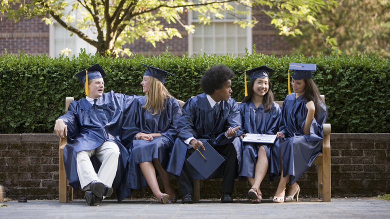 Students chatting on bench