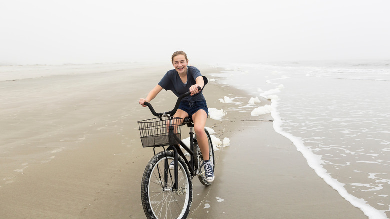 A cycling girl on beach