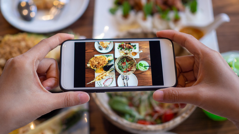 taking a photo of meal on cellphone