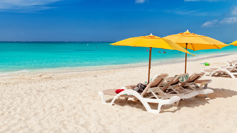 yellow umbrellas, chairs on beach