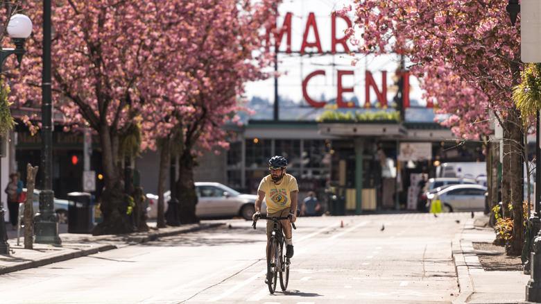 Man biking near Pike Place Market in Seattle, Washington