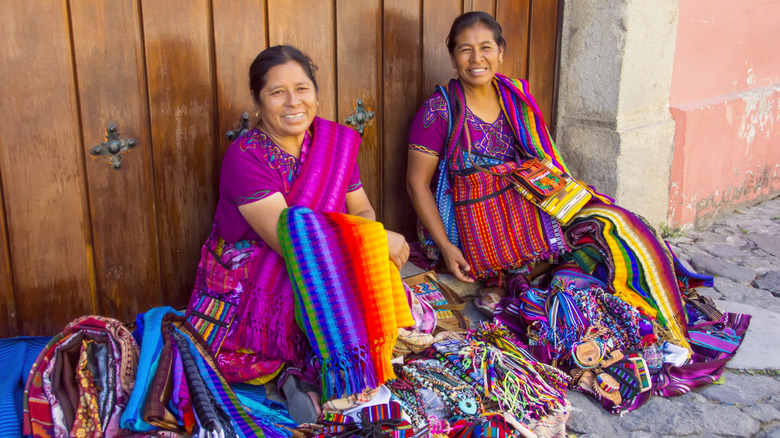 Mayan women selling textiles on the streets of Antigua, Guatemala.