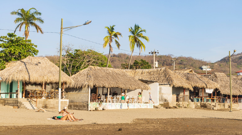 Thatched roofs on the beach at San Juan del Sur, Nicaragua.