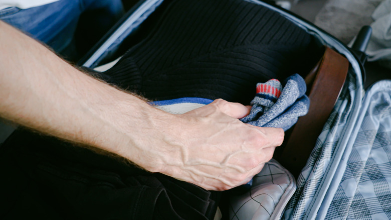 Person packing socks