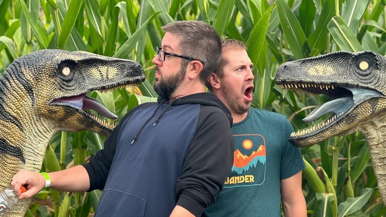 Men and dinos in corn maze