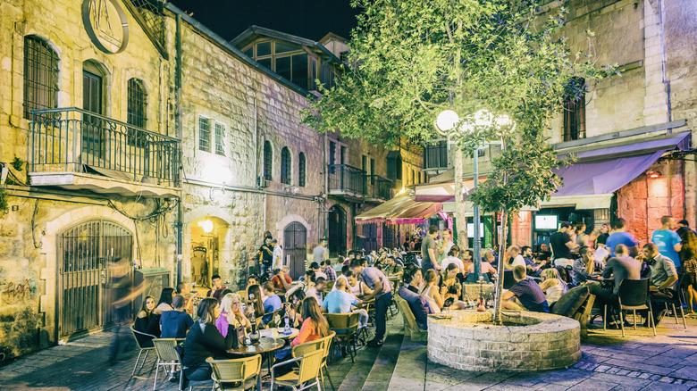 Courtyard full of crowded tables in Israel