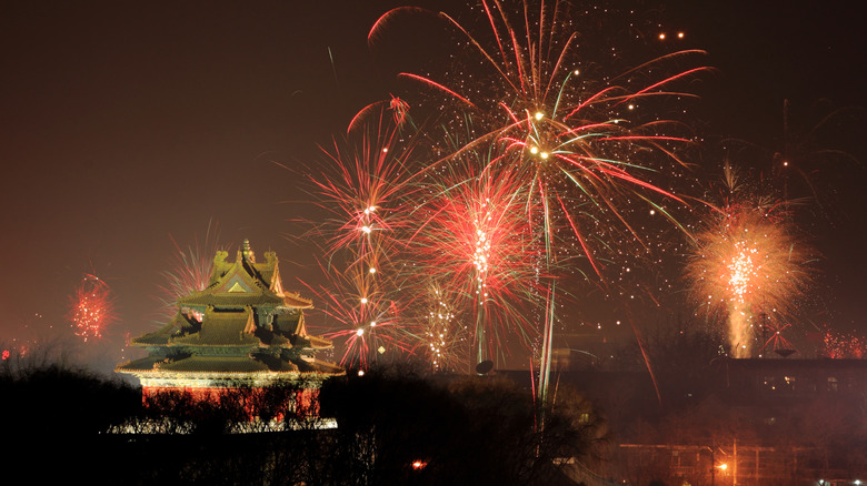 Red fireworks in Beijing night sky