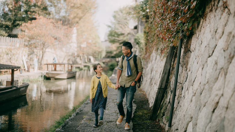 father and daughter walking