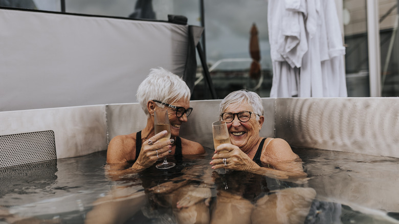 Two women relaxing in outdoor hot tub