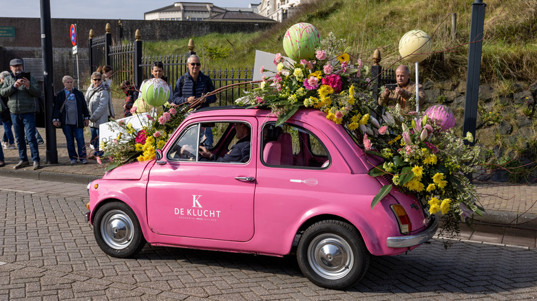 Pink flower-covered car during Bloemencorso Flower Parade, the Netherlands