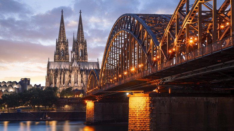 Sunset over bridge with Kölner Dom in background