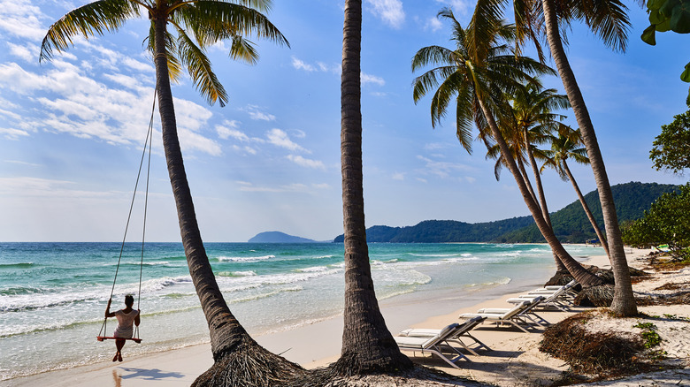 A woman on a swing at Sao Beach, Phu Quoc.