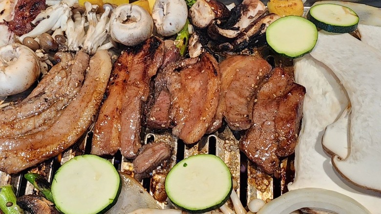 meats and vegetables on grill