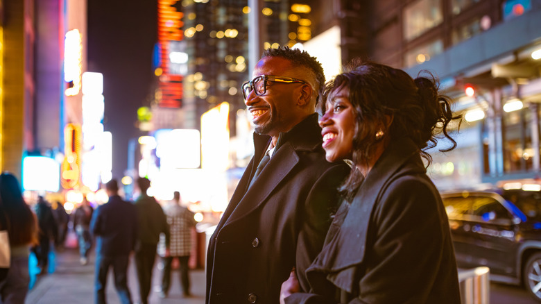 A couple walking in Times Square