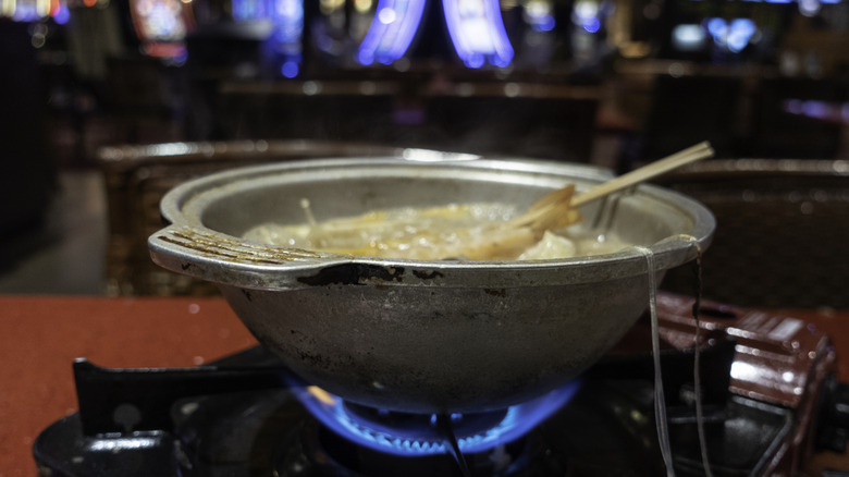 Traditional ramen dish with Vegas gambling machines in background