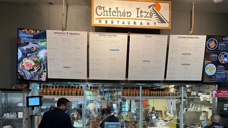 Chichén Itzá stall menu and sign inside the Mercado La Paloma