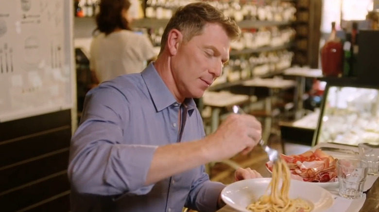 Bobby Flay eating pasta