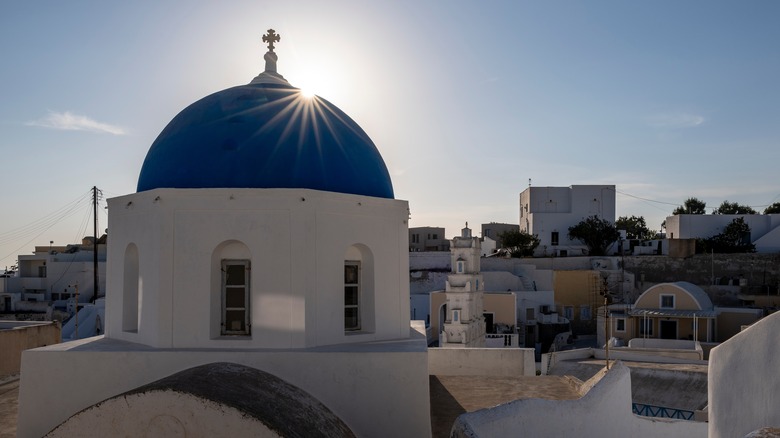 Blue-domed church in Megalochori, Santorini.