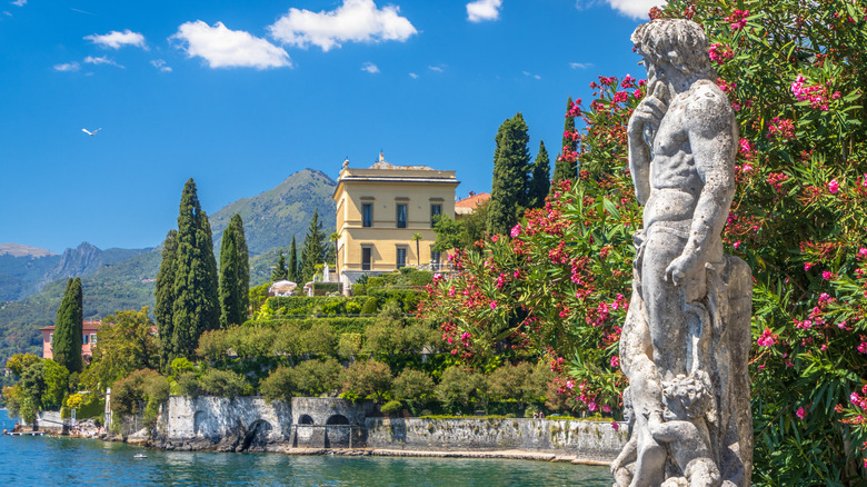 Statue near water and villas