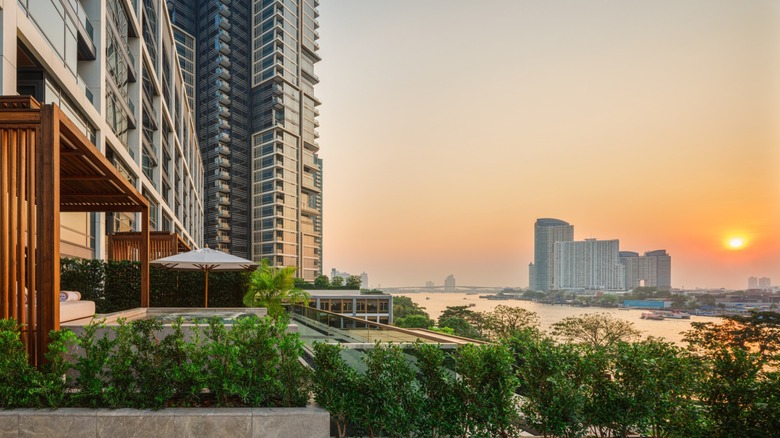 Exterior view from the Verandah Suite at Capella Bangkok hotel at sunset